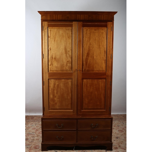 695 - A SHERATON DESIGN MAHOGANY AND SATINWOOD INLAID WARDROBE the moulded cornice above a pair of panelle... 