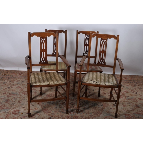 73 - A SET OF FOUR VINTAGE MAHOGANY INLAID CHAIRS including a pair of elbow chairs each with a pierced ve... 