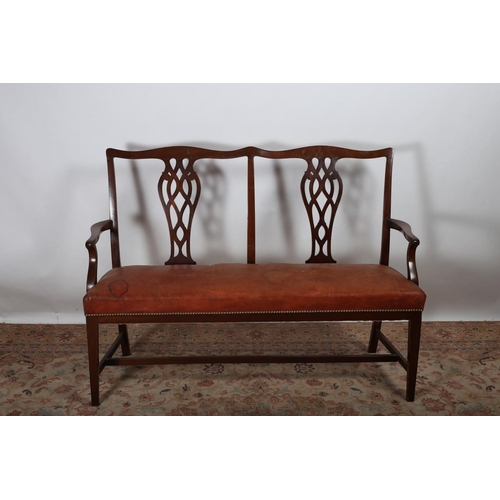 78 - A CHIPPENDALE DESIGN MAHOGANY AND HIDE UPHOLSTERED DOUBLE CHAIR BACK SETTEE the serpentine top rail ... 