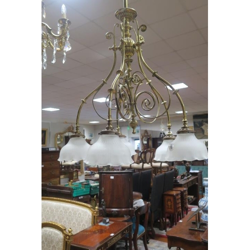 858 - A VICTORIAN BRASS FIVE BRANCH CHANDELIER the knopped and lobed central column issuing five scroll ar... 