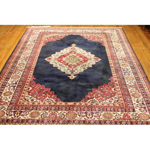 130 - A GABBEH WOOL RUG the beige and wine ground with central panel filled with flowerheads and foliage w... 