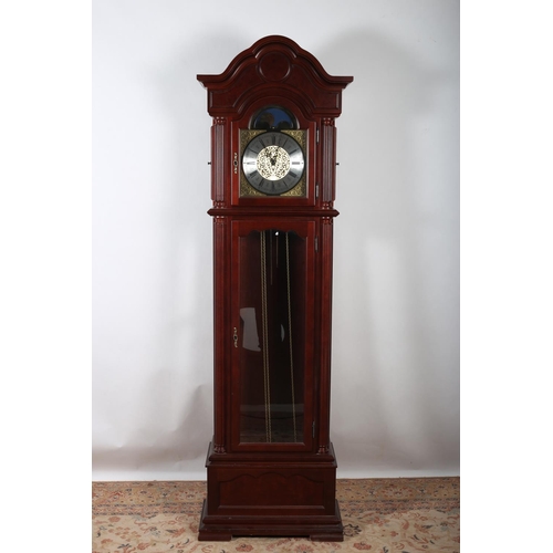 407 - A MAHOGANY LONG CASE CLOCK the arched hood above a glazed door containing a brass and silver dial wi... 