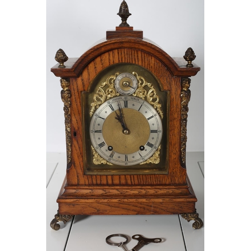 410 - A 19TH CENTURY OAK CASE AND GILT BRASS MOUNTED BRACKET CLOCK of rectangular arched outline the glaze... 