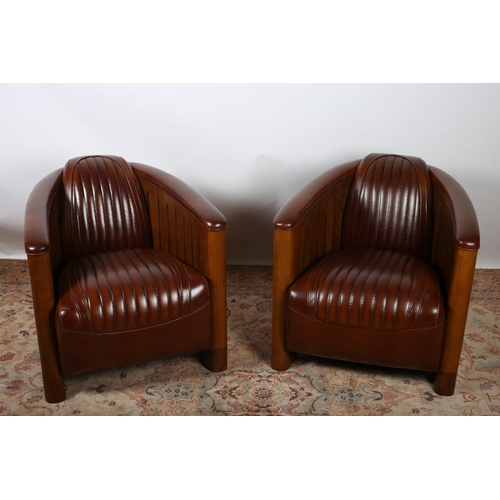 417 - A VERY FINE AND IMPRESSIVE PAIR OF CHERRYWOOD AND HIDE UPHOLSTERED AVIATION TUB SHAPED CHAIRS each w... 