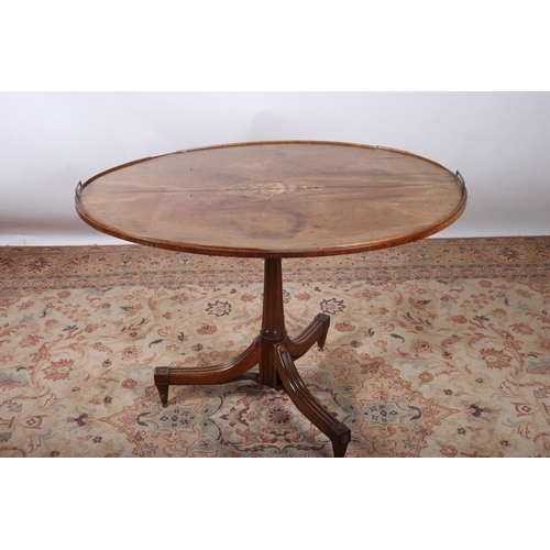 419 - A 19TH CENTURY MAHOGANY SNAP TOP TABLE of oval outline the shaped top with moulded gallery and brass... 