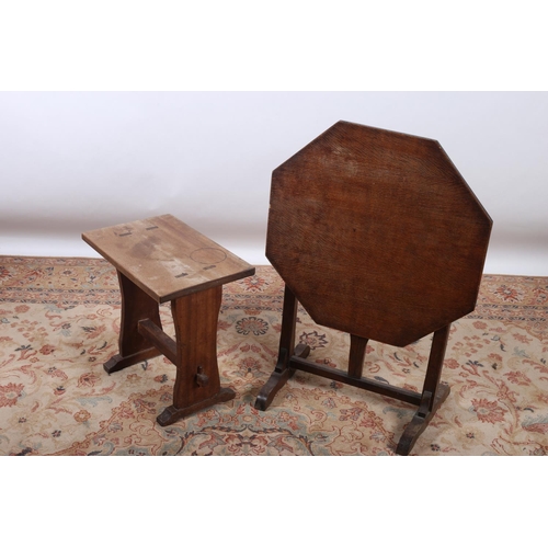 421 - A VINTAGE OAK FOLDING TABLE of octagonal outline on standard end supports and platform base together... 