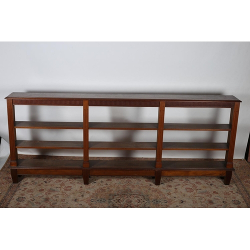 426 - A HEPPLEWHITE DESIGN MAHOGANY OPEN FRONT BOOKCASE the rectangular top above a dentil moulded cornice... 