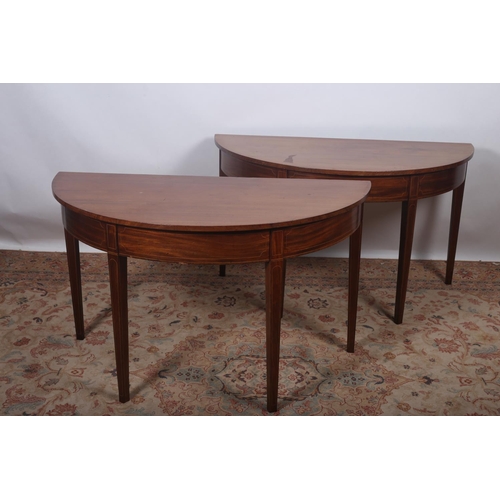 431 - A PAIR OF GEORGIAN MAHOGANY SIDE TABLES each of demilune outline the shaped tops above an inlaid fri... 