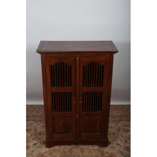 432 - A HARDWOOD SIDE CABINET of rectangular outline the moulded cornice above a pair of spindle and panel... 