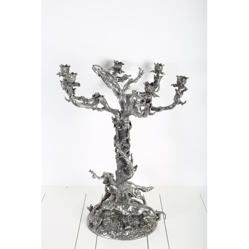 91 - A SILVER PLATED SIX BRANCH CANDELABRUM in the form of a tree with naturalistic arms on circular spre... 