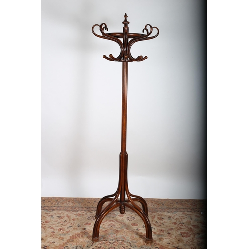 104 - A BENTWOOD HAT AND COAT STAND of typical form raised on quadruped splayed legs with bun feet
210cm (... 