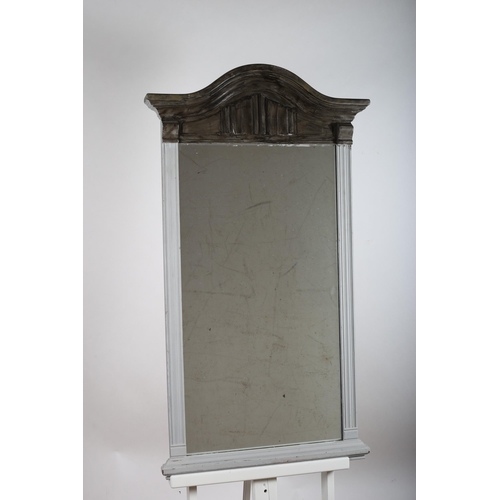 149 - A CONTINENTAL OAK PAINTED MIRROR the rectangular plate within a reeded frame with linen fold and arc... 