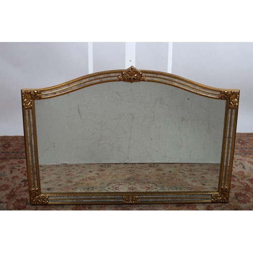 151 - A CONTINENTAL GILT FRAME MIRROR the rectangular arched plate within a moulded frame with C-scroll cr... 