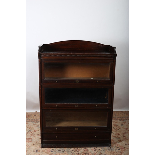 164 - A VINTAGE MAHOGANY FOUR TIER STACKING BOOKCASE of rectangular outline with moulded three quarter gal... 