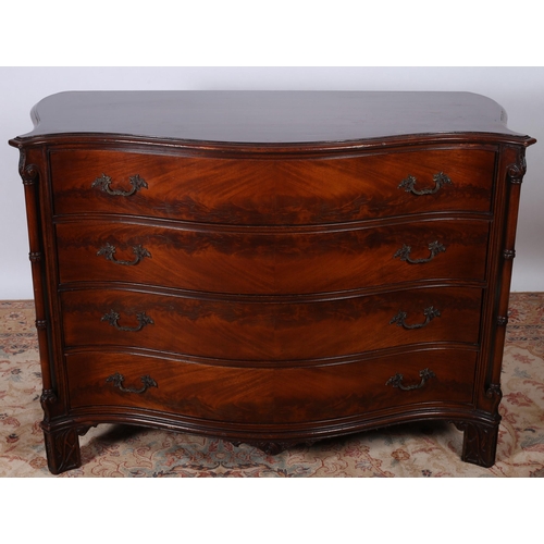 166 - A GOOD GEORGIAN DESIGN MAHOGANY CHEST of serpentine outline the shaped top above four long graduated... 