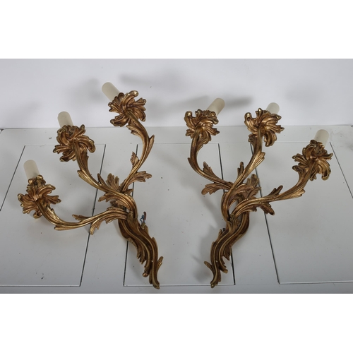 383 - A PAIR OF GILT BRASS THREE BRANCH WALL LIGHTS with foliate cast arms and drip pans
46cm (h)