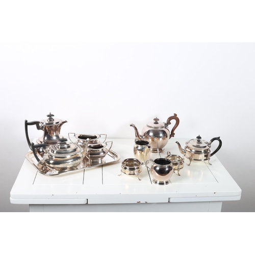 387 - A FOUR PIECE SILVER PLATED TEA AND COFFEE SERVICE by Walker and Hall on plated and engraved tray tog... 