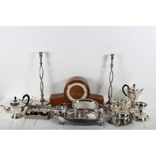 391 - A COLLECTION OF PLATED WARE to include a four piece tea and coffee service, plated sauce boat, pierc... 