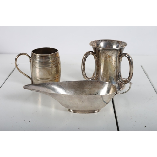 396 - A SILVER LOVING CUP together with a miniature silver sauce boat, a silver mug in the form of a barre... 