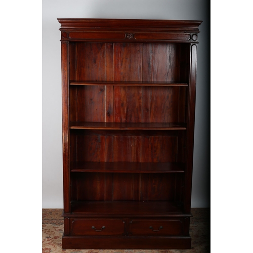 4 - A MAHOGANY OPEN FRONT BOOKCASE the moulded cornice above four open shelves three adjustable the base... 