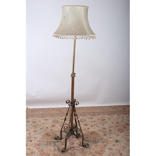 55 - A 19TH CENTURY BRASS TELESCOPIC FLOOR STANDARD LAMP the cylindrical column raised on scrolled suppor... 