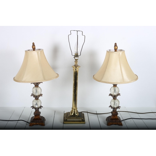 63 - A BRASS TABLE LAMP with reeded column above a square based together with a pair of continental table... 