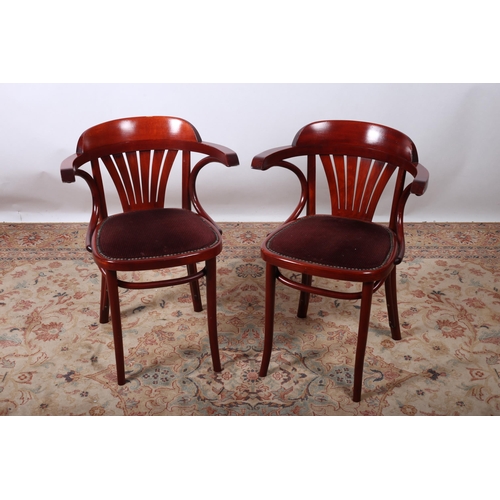 637 - A PAIR OF BENTWOOD ELBOW CHAIRS of typical form with upholstered seats