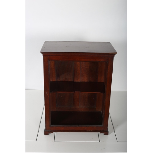 69 - A GEORGIAN DESIGN MAHOGANY MINIATURE CABINET the rectangular outline with hinged door lacking glazed... 