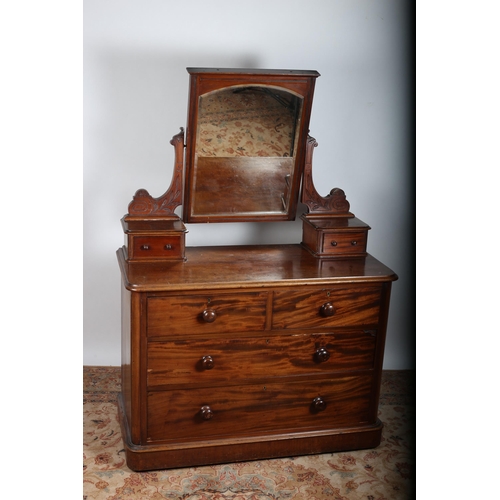 85 - A 19TH CENTURY MAHOGANY DRESSING CHEST the superstructure with bevelled glass swivel mirror flanked ... 