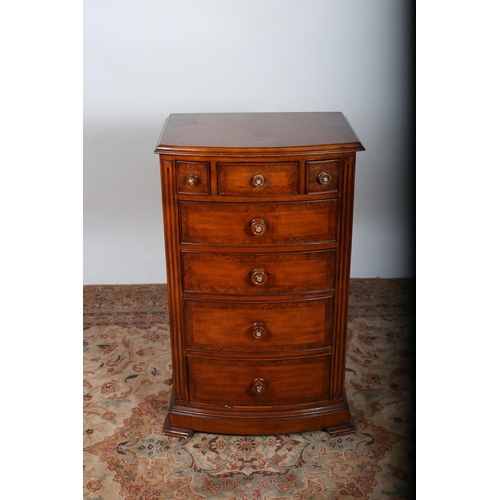 93 - A CHERRYWOOD CROSSBANDED CHEST of demi lune outline the shaped top above three short drawers above f... 