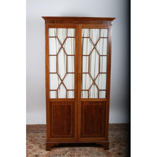 95 - A SHERATON DESIGN MAHOGANY AND SATINWOOD INLAID DIAMOND DOOR WARDROBE the moulded cornice above a pa... 