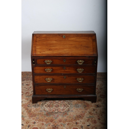 96 - A GEORGIAN MAHOGANY CROSSBANDED BUREAU the hinged lid containing pigeon holes and drawers with toole... 