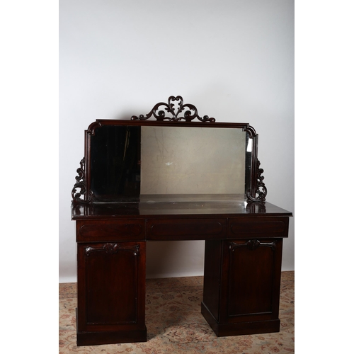 99 - A VICTORIAN MAHOGANY PEDESTAL SIDEBOARD the rectangular mirrored back with pierced C-scroll cresting... 