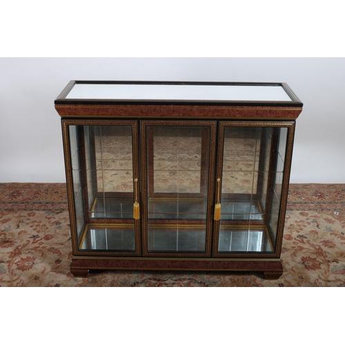 220 - A CONTINENTAL EBONISED WALNUT AND BRASS INLAID CHINA DISPLAY CABINET of rectangular outline the shap... 