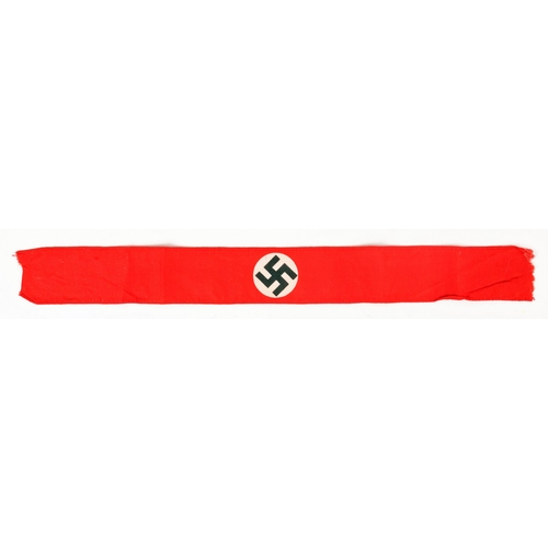 170 - Narrow NSDAP rally armband. A red cloth armband centred with a swastika on a white circular backgrou... 