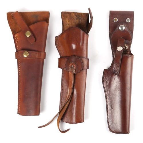 374 - Three Western-style holsters, suitable for single action revolvers. A Cogswell & Harrison holster, m... 