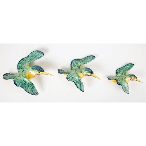 466 - A set of three Beswick pottery graduated wall plaques modelled as kingfishers, printed and impressed... 