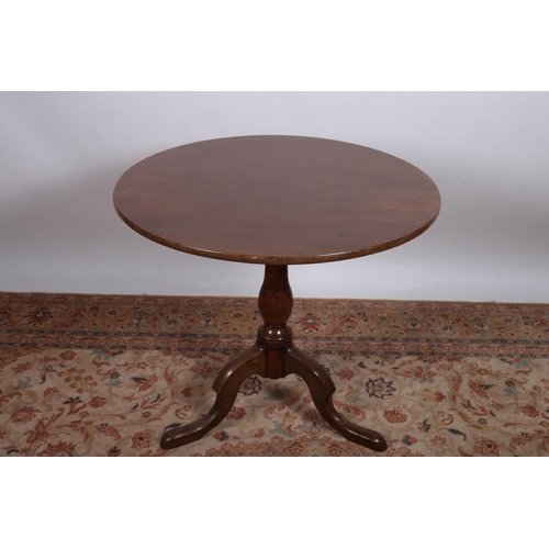 3 - A GEORGIAN MAHOGANY SNAP TOP TABLE the circular moulded top above a baluster column on tripod suppor... 