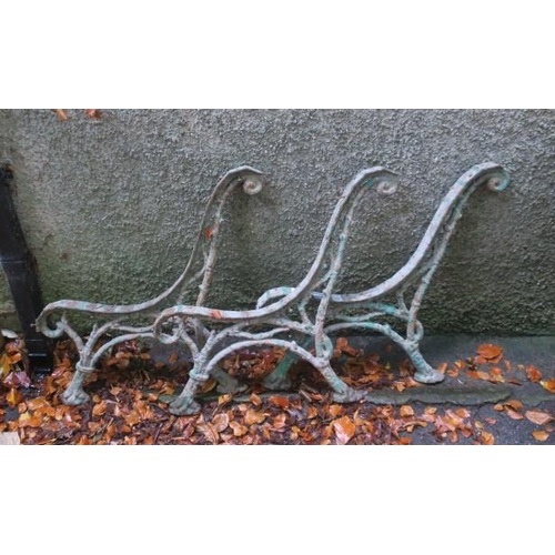 794 - THREE 19TH CENTURY CAST IRON BENCH ENDS each of rustic form with scroll capitals on hoof feet 
75cm ... 