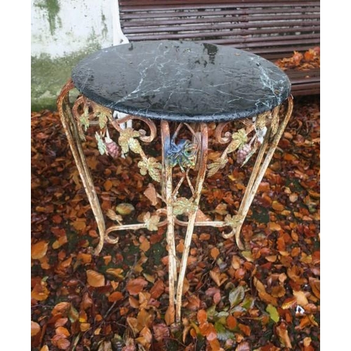 805 - A WROUGHT IRON AND MARBLE TABLE of circular outline surmounted by a green veined marble top with scr... 