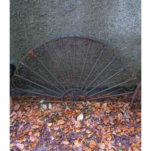 817 - A 19TH CENTURY WROUGHT IRON FAN LIGHT of demi lune outline with scroll decoration 
75cm (h) x 180cm ... 