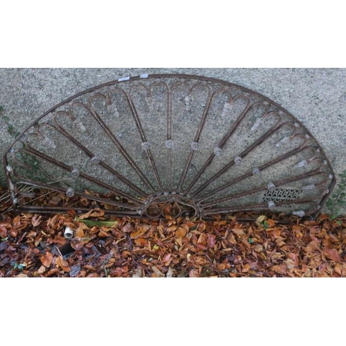 819 - A 19TH CENTURY WROUGHT IRON FAN LIGHT of demi lune outline with pierced scroll stretchers and knoppe... 