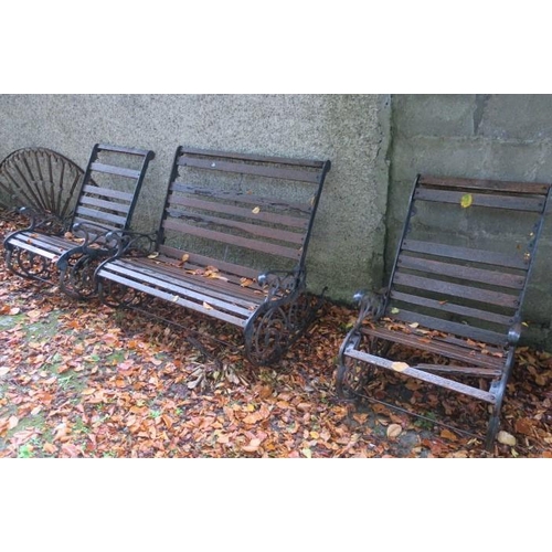 820 - A THREE PIECE WROUGHT IRON GARDEN SUITE comprising a pair of rocking chairs and bench en suite (AF) ... 