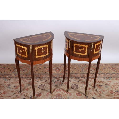 698 - A PAIR OF CONTINENTAL WALNUT MARQUETRY AND GILT BRASS MOUNTED SIDE TABLES of demi lune outline the s... 