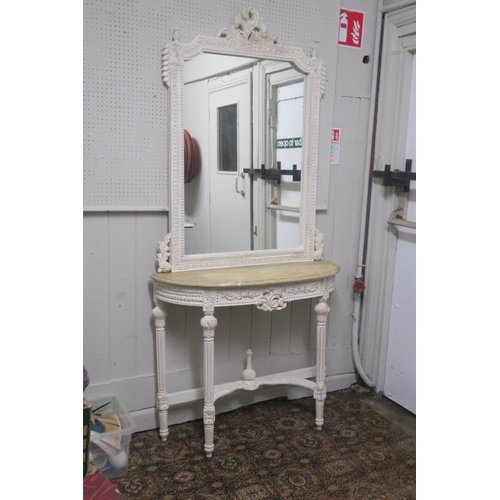 750 - A CONTINENTAL LIMED OAK AND MARBLE CONSOLE TABLE of demi lune outline with veined marble above a car... 