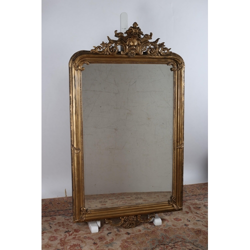 772 - A CONTINENTAL GILT FRAME MIRROR the rectangular bevelled glass plate within a beadwork and moulded f... 