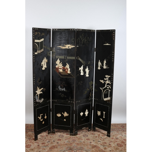 14 - A CHINESE BLACK LACQUERED FOUR FOLD SCREEN overlaid with figures, foliage and vessels 
183cm (h) x 1... 