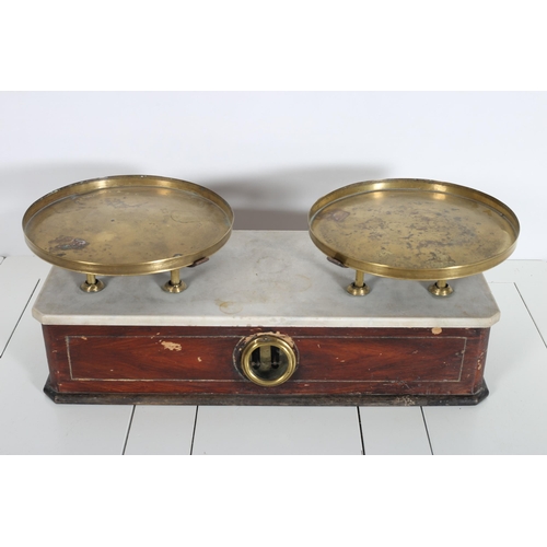 2 - A VINTAGE MAHOGANY MARBLE AND BRASS WEIGH SCALES the circular dish pans above a marble top flanked b... 