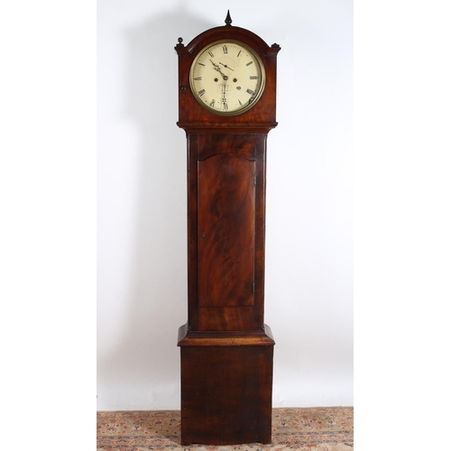 20 - A 19TH CENTURY MAHOGANY LONG CASED CLOCK by Hanlon Dublin the arched hood containing a painted dial ... 