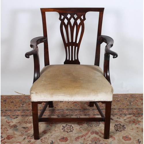 35 - A GEORGIAN MAHOGANY CHIPPENDALE DESIGN ELBOW CHAIR the pierced vertical splat above an upholstered s... 